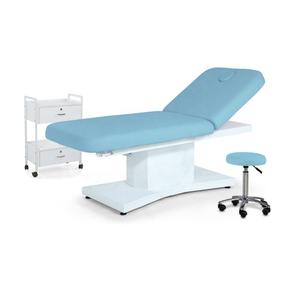 Mesa de masaje eléctrica azul, sofá, esteticista, spa, cama facial